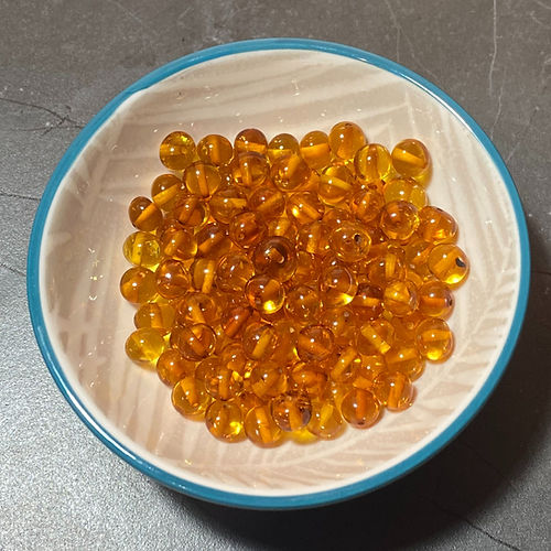 Honey Amber Beads Polished In a Bowl